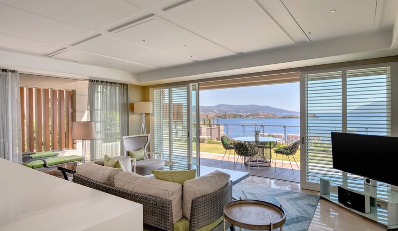 CARESSE HOTEL - TWO BEDROOM SUITE LIVING ROOM